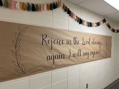 a sign on the wall that says, rejoice in the lord during againn will you be replaced?