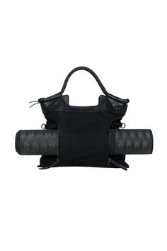 "Black tote with leather detail doubles as a yoga mat bag, laptop bag for work, and carry-on travel tote with zipper. It moves from one function to the next in sophisticated style. Its fold over feature and long detachable strap turns this tote into a crossbody handbag in a flash. It's perfect for travel so you don't need to take two bags.  Its feature vertical zips reveal a pocket ideal for wet items, yoga mat or easy access to travel documents while traveling. This bag is thoughtfully built to last and holds many possibilities. It will be your go-to for years to come. Made in BALI. \"I am over the moon happy with my Just Breathe Satchel. I'd been eyeing it for a while and was unsure about purchasing it without touching it and feeling it. I am so happy about the quality of construction an Luxury Tote Laptop Bag For Travel, Luxury Tote Laptop Bag With Detachable Strap, Luxury Tote Travel Bag With Zipper Pocket, Luxury Tote Travel Bag With Zipper Closure, Luxury Laptop Bag With Detachable Handle In Tote Style, Luxury Travel Laptop Bag Tote, Luxury Black Nylon Gym Bag, Luxury Travel Tote Bag With Zipper Pocket, Luxury Black Nylon Travel Bag