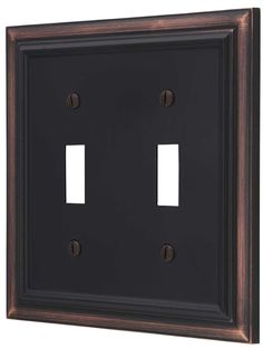 two toggles are mounted on the wall in an old - fashioned style frame