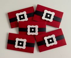 four red cards with black and white designs on them