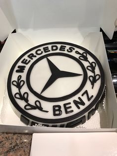 a mercedes logo cake in a box