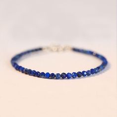 Free eBay listing template designed by dewiso.com Natural Lapis Lazuli Stone Dainty Bracelet Blue Gemstone Bracelet Minimalism Fast shipping from US Local Warehouse. US address order only takes 1~3 days Lapis Lazuli is a powerful crystal for activating the higher mind and enhancing intellectual ability. It stimulates the desire for knowledge, truth and understanding, and aids the process of learning. It is excellent for enhancing memory. A stone of truth, Lapis encourages honesty of the spirit, and in the spoken and written word. Wear it for all forms of deep communication. It is also a stone of friendship and brings harmony in relationships. A Lapis grid brings calm and loving communication for a home with temperamental teenagers, or children with Asperger's syndrome, autism, or attention Blue Gemstone Bracelet, Blue Stone Bracelet, Hummingbird Earrings, Lapis Jewelry, Lapis Lazuli Beads, Dainty Bracelet, Lapis Lazuli Stone, Bracelet Blue, Dainty Bracelets