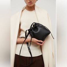 Compact Yet Iconic, Our Mini Mini Bucket Bag Is Perfect For Traveling Light. Crafted From Premium Saffiano Italian Leather, It Includes An Adjustable Crossbody Strap And A Cinch Closure, Ideal For Your Iphone. Mansur Gavriel Bag, Mini Bucket Bag, Mini Bucket Bags, Mini Bucket, Mini Mini, Mansur Gavriel, Walker Boots, Pajama Shirt, Fit N Flare Dress