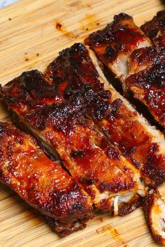 some ribs are cut up on a cutting board