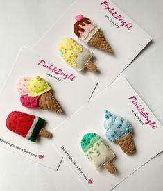 three ice cream cones with different designs on them sitting next to each other in front of a card