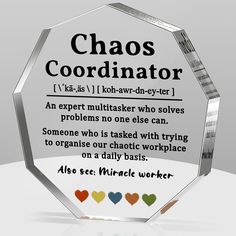 a glass award with the words chaos coordrator on it's front and back sides