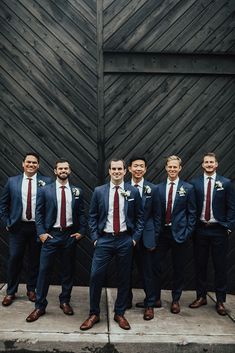 a group of men in suits standing next to each other