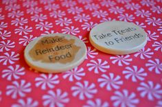 two buttons that say make reminders to friends on a red tablecloth with white flowers