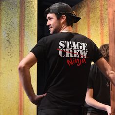 The Stage Crew Ninja T-shirt is the perfect gift for stage technicians and show workers. Designed for theater fitters and sound and lighting engineers, this t-shirt is a tribute to those who orchestrate concerts and shows behind the scenes. The back is branded with the humorous Stage Crew Ninja logo in the same way as the front. If you would like to purchase this product in bulk for your team, please get in touch. We will give you a discount. This tshirt goes perfectly with jeans or black, red, Fan Merchandise Crew Neck T-shirt For Music Festivals, Band Merch Crew T-shirt For Fan Merchandise, Pre-shrunk Crew Neck Band Merch T-shirt, Hip Hop Crew Neck T-shirt With Branding, Hip Hop Style Crew Neck T-shirt With Branding, Hip Hop T-shirt With Band Logo For Concerts, Hip Hop Band Logo T-shirt For Concert, Ninja Logo, Team Tshirt