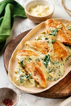 Creamy spinach artichoke chicken is a fast and easy one-pan dinner recipe brimming with briny artichokes, spinach, and lots of melty cheese. #spinachartichoke #chicken #chickendinner Creamy Spinach Artichoke Chicken, Artichoke Sauce, One Pan Dinner Recipes, Ranch Casserole, Spinach Artichoke Chicken, Chicken Bacon Ranch Casserole, Chicken Cooking, Artichoke Chicken, One Pan Dinner