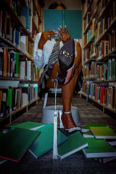 a woman sitting on top of a chair in a library