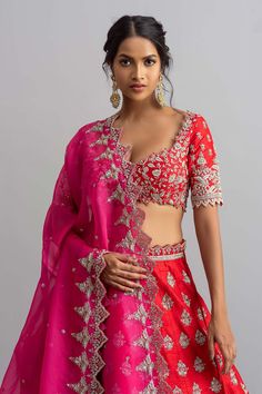 Red raw silk lehenga with all-over floral motifs, cutwork hem and zardozi work. Comes with blouse and contrast organza dupatta.
Components:3
Embroidered
Neckline:V Neck
Sleeve Length:Half
Fabric:Raw Silk; Dupatta: Organza
Color:Red

Tie-up cutout back
Cutwork detail
Kamar tassels
Note: Cancan worn by the model is not for sale - Aza Fashions Red Dola Silk Lehenga For Eid, Red Art Silk Lehenga For Eid, Red Dola Silk Lehenga With Sheer Dupatta, Red Semi-stitched Lehenga With Unstitched Blouse, Red Lehenga With Sheer Dupatta In Art Silk, Red Silk Lehenga With Sheer Dupatta, Red Dola Silk Choli With Sheer Dupatta, Red Chanderi Lehenga For Wedding, Designer Red Dola Silk Lehenga