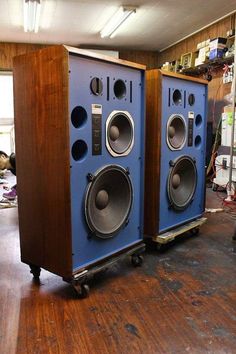 two speakers sitting side by side in a room