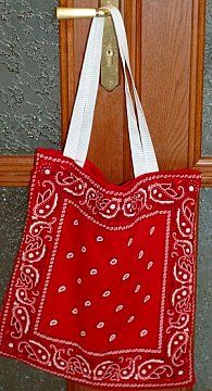 a red bandana bag hanging on a door