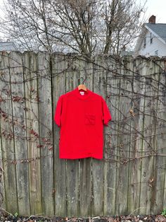 This is an amazing shirt that is just waiting for you to make your life amazing. If you want to look and feel great, get this now. It is in great condition and has no rips, holes, stains or smells.  Measurements:  Pit to pit: 20 1/4 inches  Collar to bottom front: 23 inches  Collar to bottom back: 25 1/4 inches  Size on tag: no tag (measures like a medium) 90s Style Red Cotton Shirt, 90s Style Red Cotton T-shirt, Vintage Red Short Sleeve T-shirt, Columbus Blue Jackets, Bobbie Brooks, Blue Jacket, Columbus, Favorite Things Gift, Cool Shirts