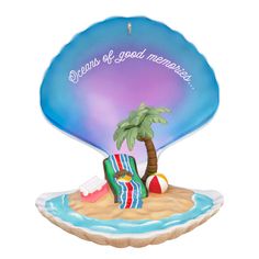 an ornament with a beach chair and palm tree in the middle of it