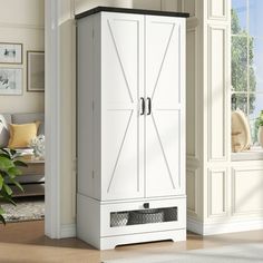 a tall white cabinet in the corner of a room