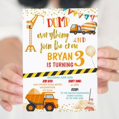 a person holding up a construction themed birthday party card that says dump everything and join the crew