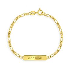 Delight your favorite little loved one with this precious ID bracelet. Crafted in yellow gold flashed 925 sterling silver, this charming design features a rectangle-shaped engravable ID tag centered on a Figaro chain. Polished to a bright shine, this 5.5-inch bracelet secures with a spring-ring clasp. Order a traditional ID bracelet today and we'll neatly package it into its own lovely gift box! Classic Personalized Rectangular Bracelets, Classic Personalized Rectangular Bracelet, Classic Personalized Gold Bracelet Gift, Personalized Hypoallergenic Yellow Gold Name Bracelet, Classic Personalized Rectangular Name Bracelet, Classic Sterling Silver Gold Bracelet, Gold Rectangular Name Bracelets, Elegant Name Bracelets With Rectangular Shape, Rectangular Gold Name Bracelets