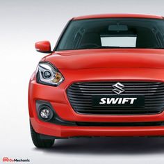 the front end of a red suzuki swift