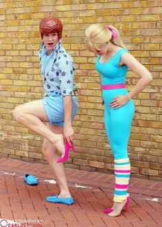 two women in matching outfits are posing for the camera while one woman holds her leg up