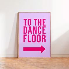 a pink poster with the words to the dance floor and an arrow pointing towards it