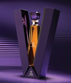 an empty bottle in a purple box on a purple and black background with the lid open