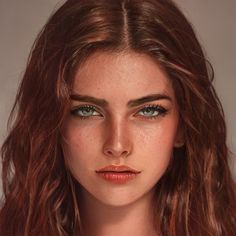 a woman with freckled hair and green eyes