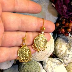 These stunning dangle earrings are handcrafted from 925 sterling silver and feature intricate reproductions of ancient Roman, Greek, and Egyptian coins. Perfect for history lovers, these unique earrings capture the timeless elegance of ancient civilizations. The delicate design adds a touch of antiquity and sophistication to any outfit, making them an ideal gift for someone special. Whether for a birthday, anniversary, or holiday, these earrings are a thoughtful way to celebrate timeless beauty and craftsmanship. Material: 925 Sterling Silver Style: Dangle Earrings Coin Theme: Roman, Greek, Egyptian Mythology Lightweight and comfortable for daily wear Great gift for history enthusiasts and jewelry lovers alike Egyptian Coins, Ancient Roman Jewelry, Roman Jewelry, Delicate Design, Outfit Making, Ancient Romans, Ancient Civilizations, Jewelry Lover, Unique Earrings