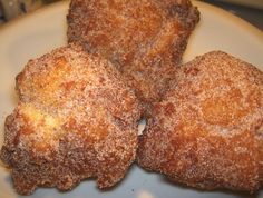 three fried pastries on a white plate