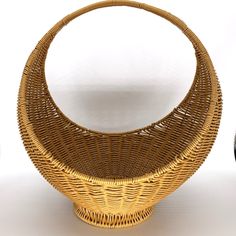 a wicker basket sitting on top of a white table