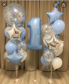 blue and white balloons are in the shape of numbers