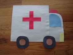 a paper bag with a red cross on it and a truck cut out from it