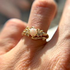 a woman's hand with a ring on it