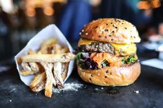 a hamburger and french fries on a table