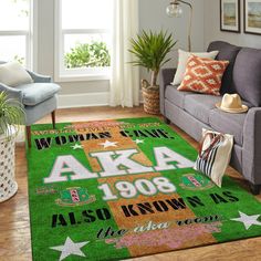 a green area rug with the words alaska and stars on it in front of a couch