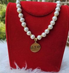 Sorority necklace for the stylish lady that wants her jewelry to speak to who She Is Sorority Necklace, Stylish Lady, Pearl Necklaces, Social Club, To Speak, Sorority, Stylish Women, African American, Pearl Necklace