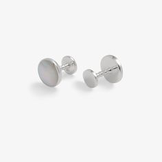 These silver mother of pearl round pair of cufflinks are made of 100% sterling silver and made in the United Kingdom. Sterling Silver Cufflinks For Formal Wear, White Gold Cufflinks For Business, Classic Round Sterling Silver Cufflinks, Round Screw Back Cufflinks For Business, White Jewelry With Polished Finish For Business, White Polished Jewelry For Business, Business White Polished Jewelry, Modern Sterling Silver Cufflinks With Polished Finish, Round Polished Finish Cufflinks For Business