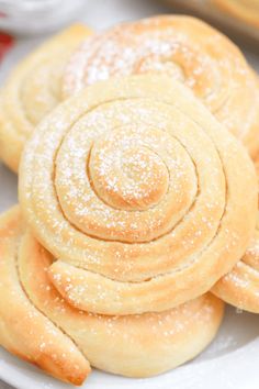 some sugary pastries are on a white plate