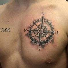 a man with a compass tattoo on his chest