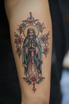 Religious tattoo featuring a praying woman with a halo, surrounded by decorative flowers. Immaculate Heart Tattoo, Hail Holy Queen