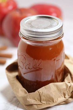 a jar filled with liquid sitting on top of a table