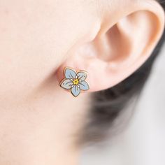 Forget Me Not earrings in pastel blue offer a delicate and charming nod to these symbolic flowers, ensuring you're remembered just as fondly as their namesake. Ideal for adding a subtle splash of color and meaning to your style. Enamel earring with polished gold-plated metal, featuring stainless steel posts with 0.5" (13 mm) extra-long design for secure, stable wear, paired with silicone cone backs for a snug fit. Features 10x6mm full-cover, dust-proof studs. Details: * One pair of stud earrings Symbolic Flowers, Color And Meaning, Plant Earrings, Nickel Allergy, Bleu Pastel, Earrings Flower, Enamel Earrings, Earrings Blue, Heart Locket