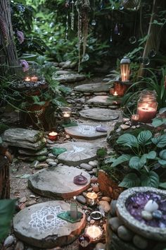 a path made out of stones with candles on it