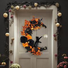 a door decorated with black and orange flowers