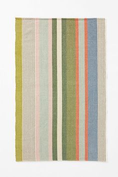 a multicolored striped rug on a white background