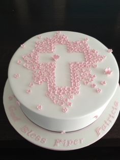 a white cake with pink frosting and stars on the top that says miss piper potter