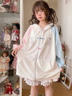 This jacket is crafted from pure cotton fabric, featuring an original design with unique prints and contrasting traditional Chinese frog button closures. Its loose fit is both flattering and stylish. The jacket also comes with convenient pockets on both sides, adding practicality to its charm. To top it off, the hood is adorned with soft and adorable bear ears, making it irresistibly cute when worn.  The price includes one jacket only.   	 		 			Size 			Free Size 		 		 			Bust 			140 		 		 			Le Cute Cotton Hooded Outerwear, Cute Cotton Hooded Jacket With Long Sleeves, Cute Long Sleeve Cotton Hooded Jacket, Harajuku Style Cotton Outerwear With Pockets, White Harajuku Long Sleeve Outerwear, White Harajuku Hooded Outerwear, White Hooded Harajuku Style Outerwear, Cute Cotton Outerwear With Pockets, Kawaii Long Sleeve Cotton Outerwear