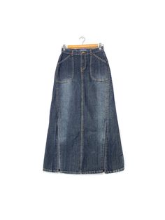 2000s Blue jeans maxi denim skirt, 2 front bottom slit Y2K 2000S Elegant and feminine vintage skirt. You can wear it in so many different stylings with t-shirt, crop top, silk top or a cardigan will fit into the season's layering thanks to its minimal trapeze line. Brand: Yilishi Tag Size: M fit like: S/M circa: 1990s-2000s color: blue fabric: denim condition: great vintage condition measurement +/- waist: 32 cm hips: 42.5cm back length: 92cm slit: 35.5cm Follow us on Instagram for the latest  @ Maxi Skirt Jeans, Maxi Denim Skirt, T Shirt Crop Top, Denim Maxi Skirt, Front Bottoms, Denim Outfit, Y2k 2000s, Silk Top, Vintage Skirt