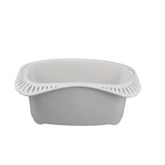 a white plastic dish with a strainer on the side